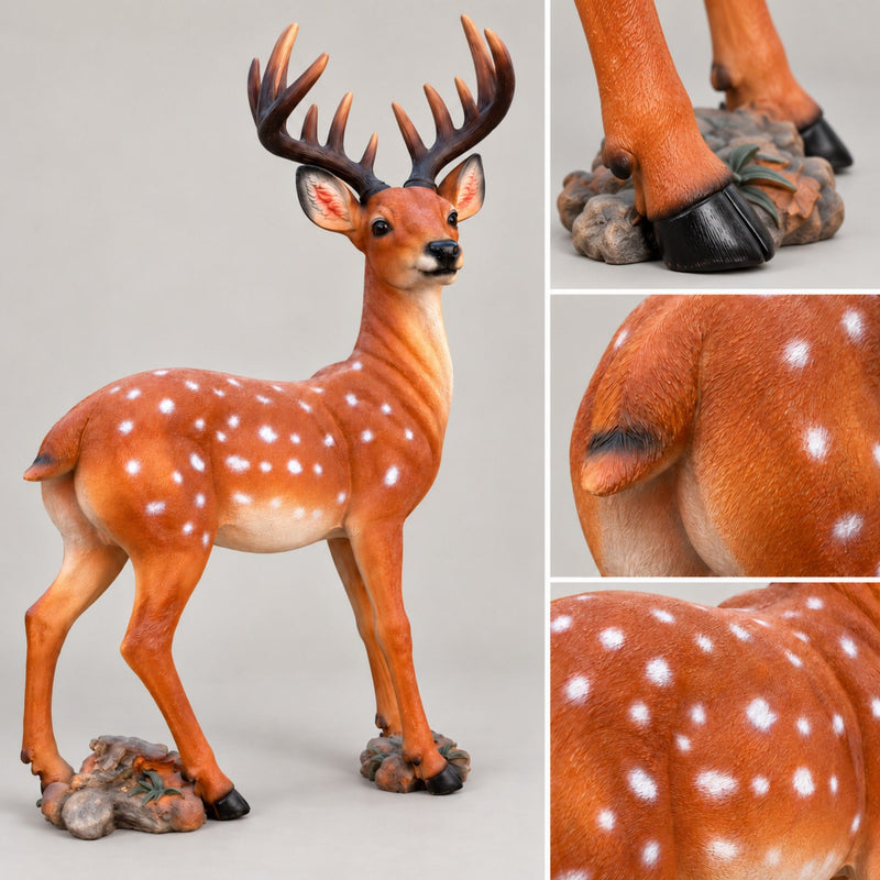Spotted brown deer statue with dark antlers, detailed hooves, and textured rocky base