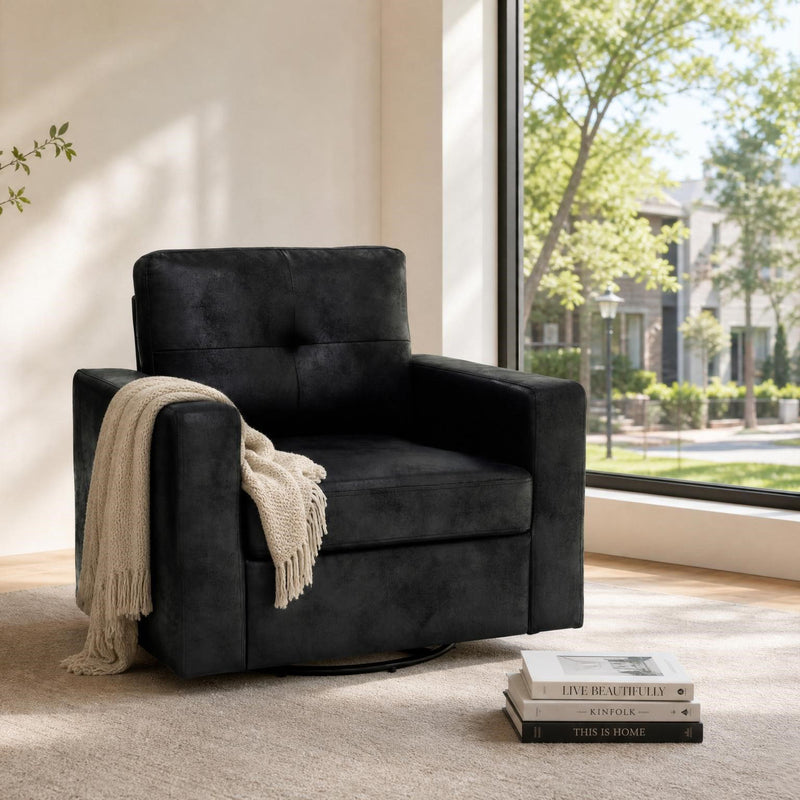 Black swivel sofa chair with wide armrests and tufted backrest, cozy lounge style