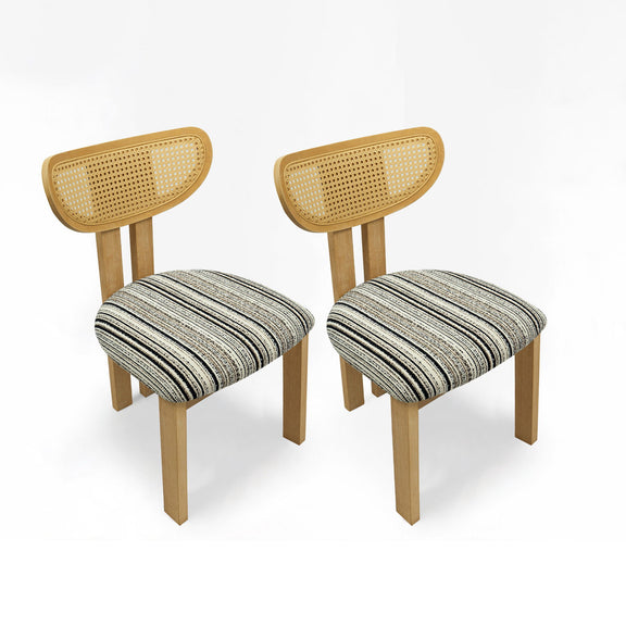 Pair of dining chairs with striped upholstered seats, woven rattan backs, and light wood frames