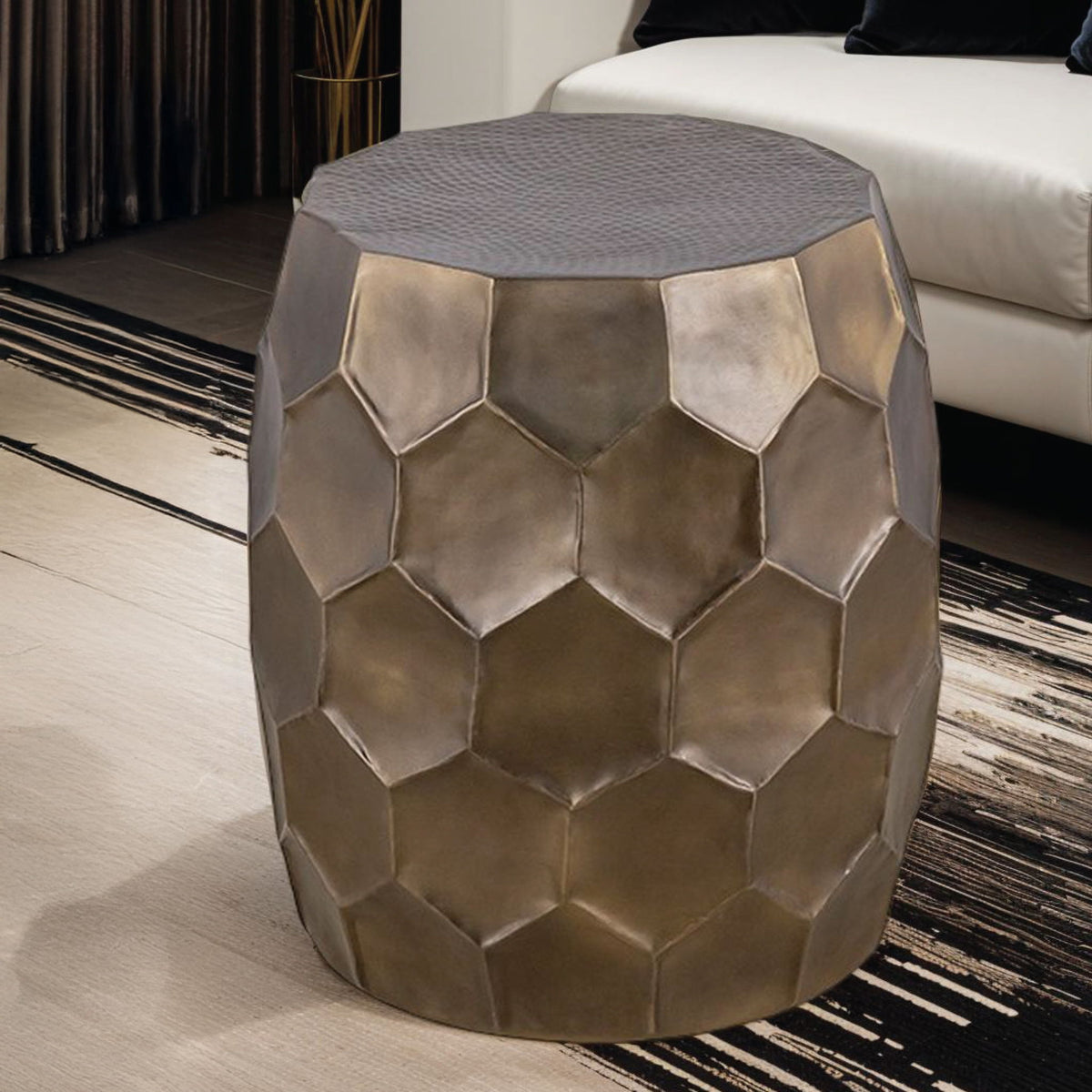 Bronze hex-pattern end table with faceted sides and dark gray textured top