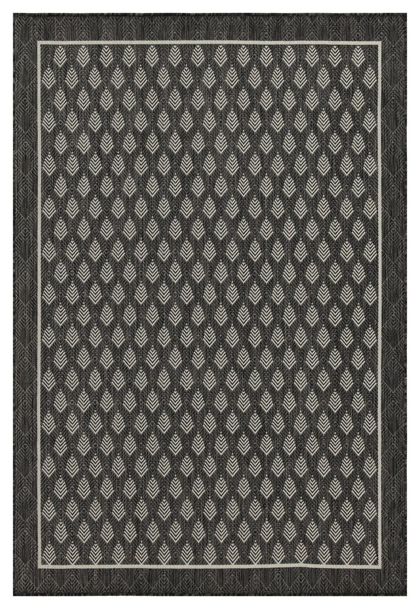 Dark gray area rug with repeating diamond pattern and light accent design