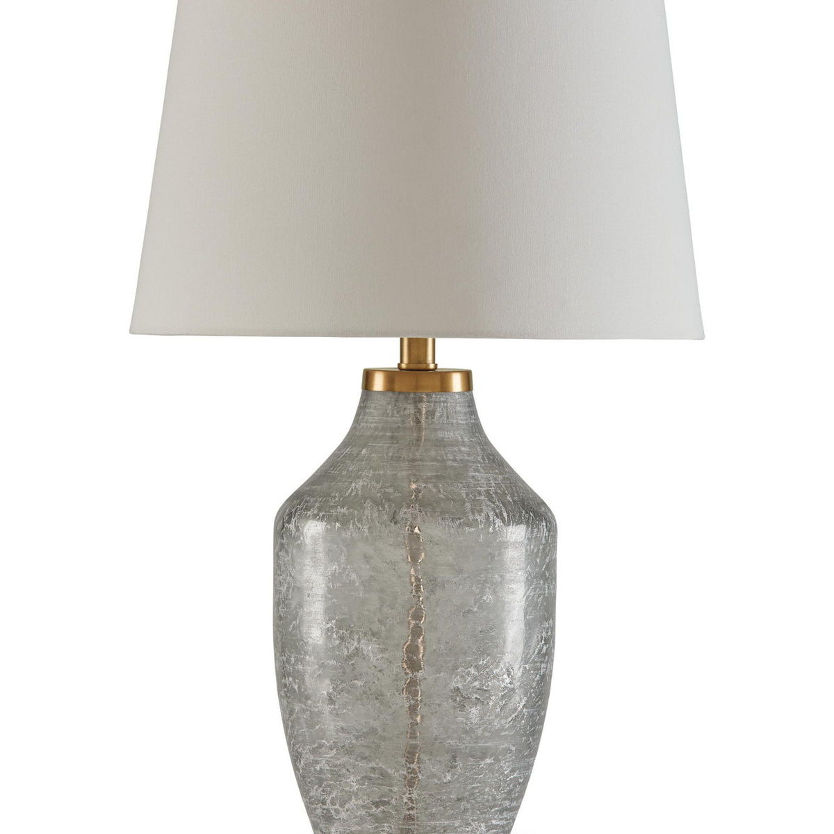 Glass table lamp with textured clear-gray base, beige fabric shade, and brass accents
