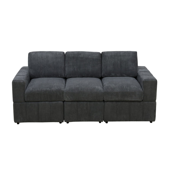 Dark gray oversized modular sectional sofa with tufted seat and armrests