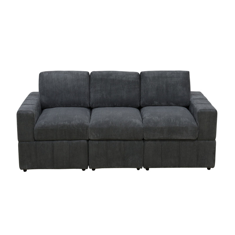 Dark gray oversized modular sectional sofa with tufted seat and armrests