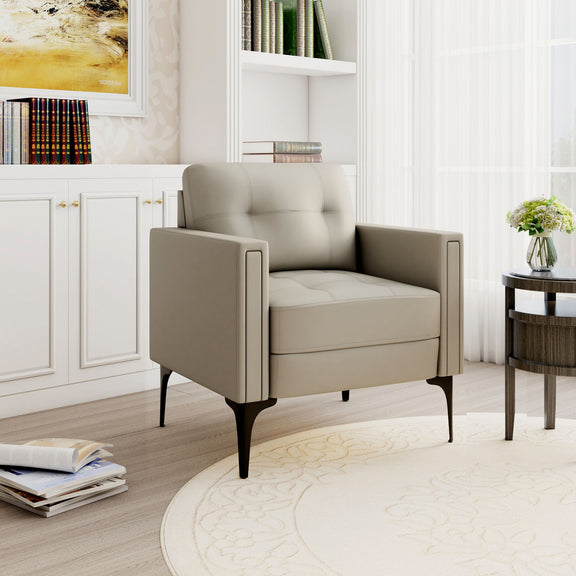 Beige upholstered armchair with tall arms and tufted back