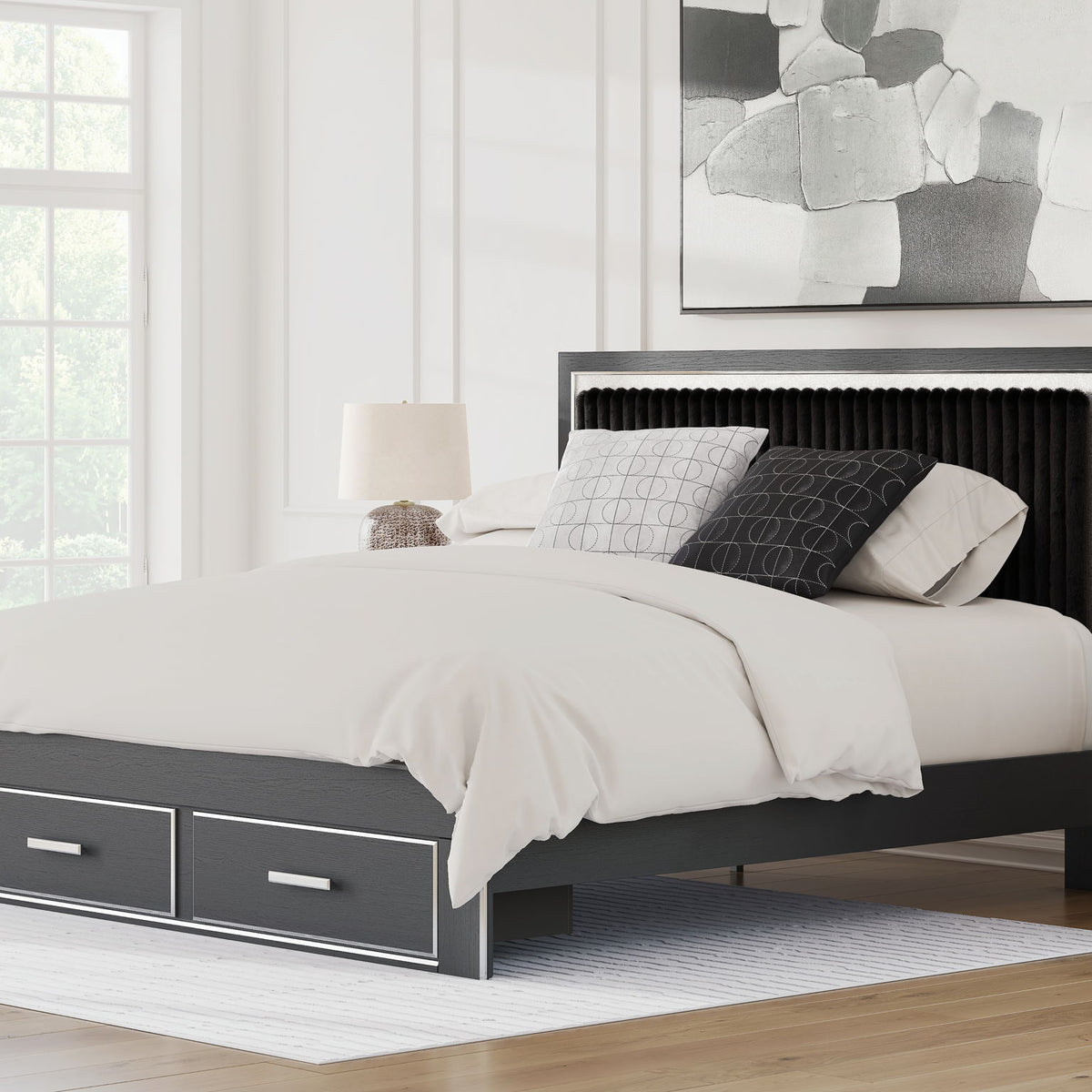 Upholstered panel storage bed in a living room, dark frame with 2 drawers, white bedding