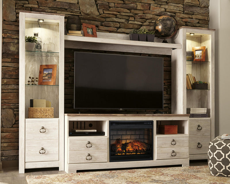 Whitewash entertainment center TV stand with dark TV panel and faux firebrick fireplace insert