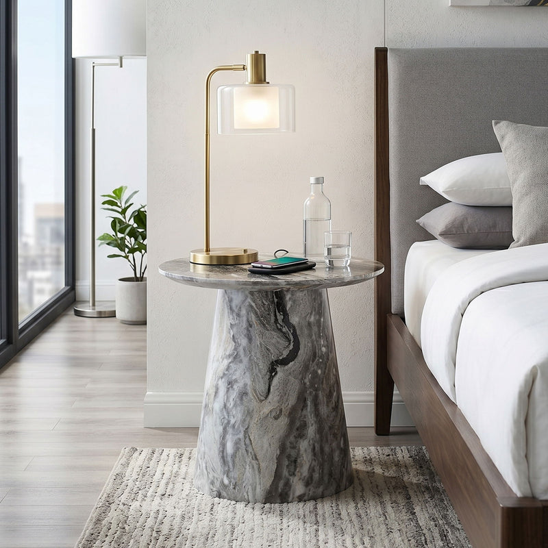 Marble-look circular coffee table with adjustable feet, gray veined finish with drinks.
