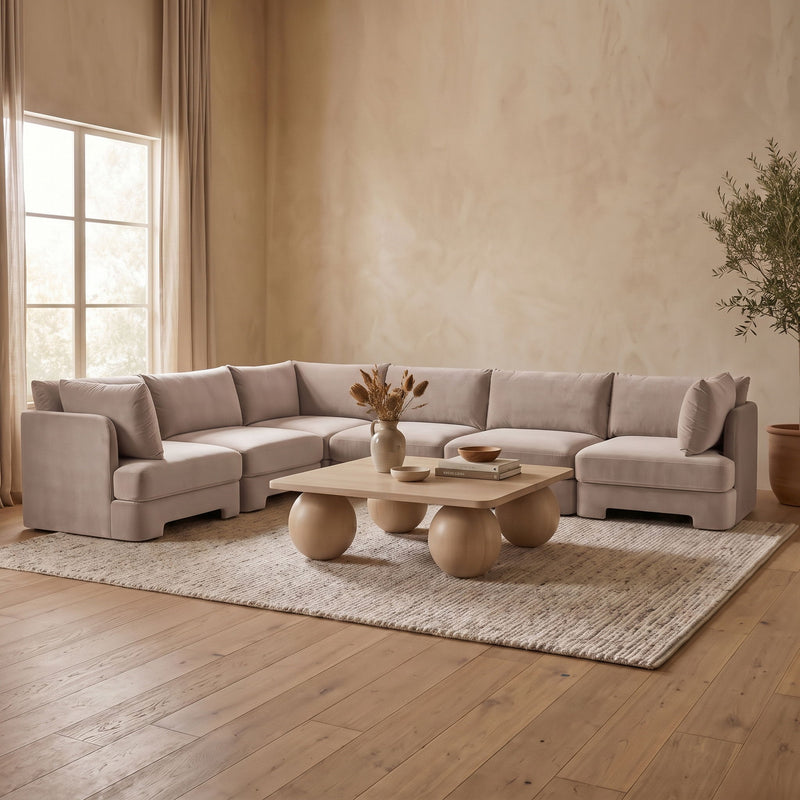 Light gray velvet performance fabric U-shaped armless sectional with tufted seat design.