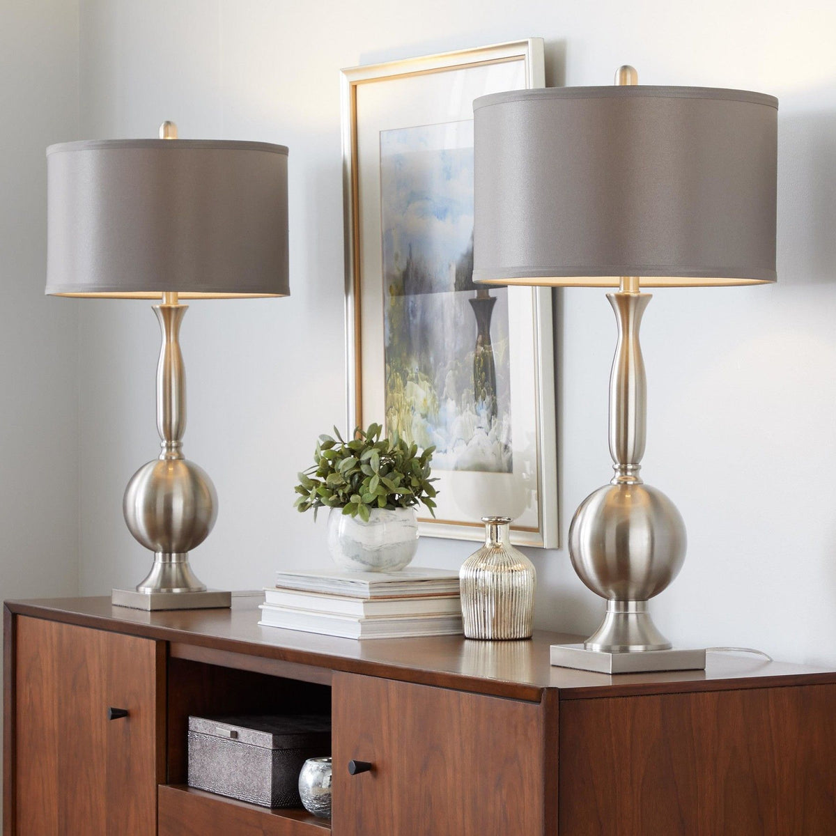Set of 2 table lamps with gray satin shades and nickel bases on wooden console