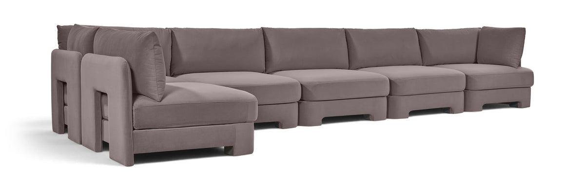 Light gray L-shaped armless sectional sofa with cushioned seat and back, velvet-style upholstery