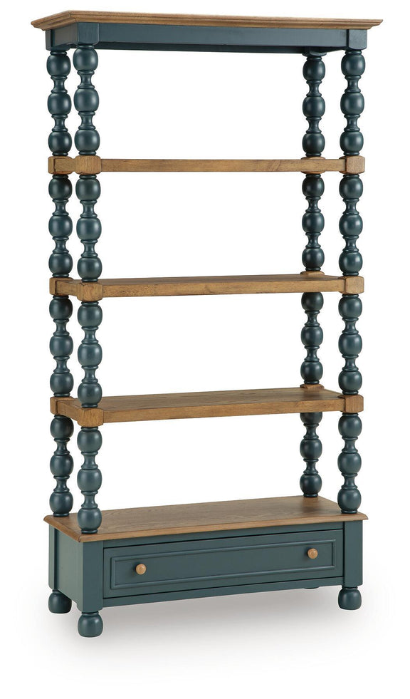 Blue bookcase with turned posts, three wood shelves, and lower drawer storage