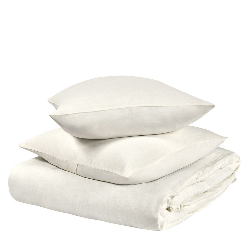 Hemp sham pillow set in ivory white, stacked with matching cushions