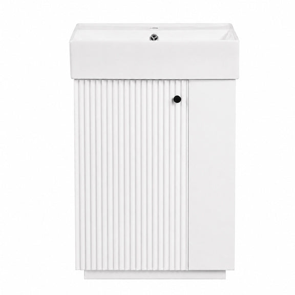 White freestanding bathroom vanity with sink top and vertical ribbed cabinet doors