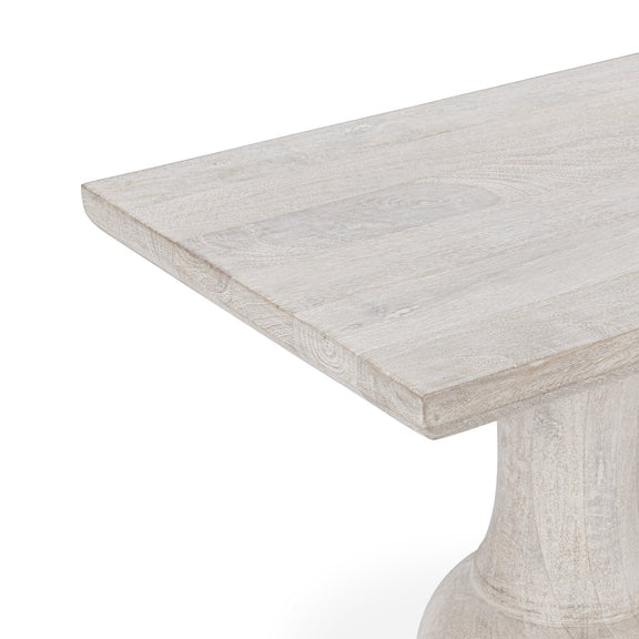 Creamwood console table close-up: distressed tabletop edge and turned pedestal base.