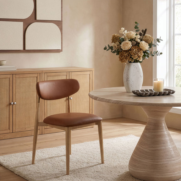 Vegan leather dining side chair with dark brown cushioned seat and light wood legs