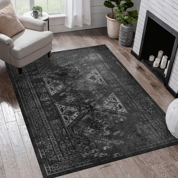 Washable area rug with black/gray distressed medallion pattern, 8x10