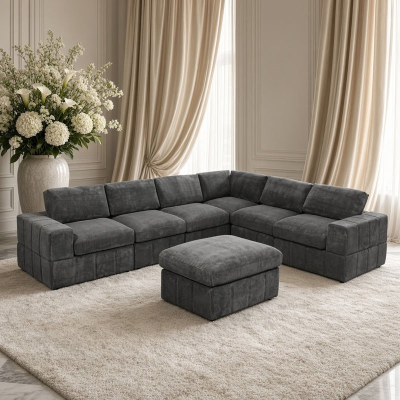 Dark gray sectional sofa with chaise and matching ottoman
