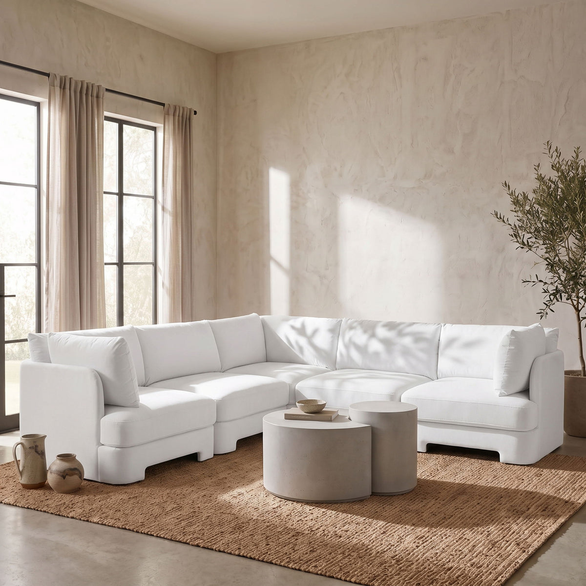 White velvet corner sectional sofa in living room setting with chaise module.