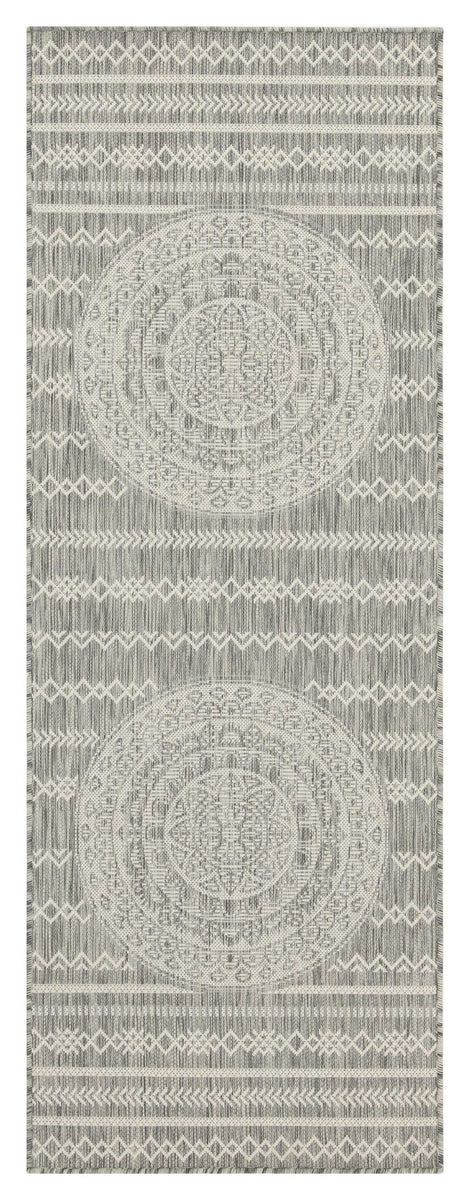Indoor/outdoor area rug with light gray circular medallion and tonal geometric stripe border