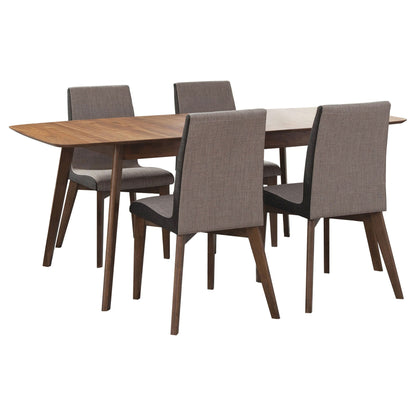 Light brown expandable dining table with five gray upholstered chairs
