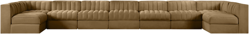 Light brown armless velvet modular sectional with tufted back cushions and curved arm ends
