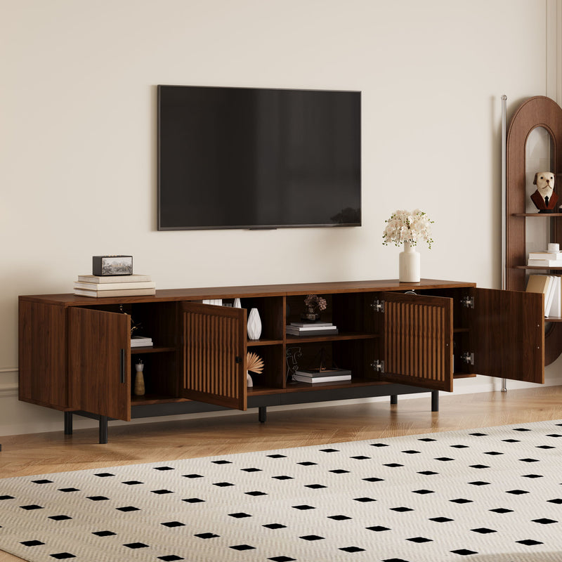 Walnut media console with open storage shelves and slatted door panels