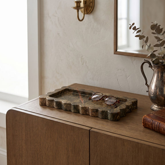 Light beige genuine marble tray with scalloped rim and rectangular center well.