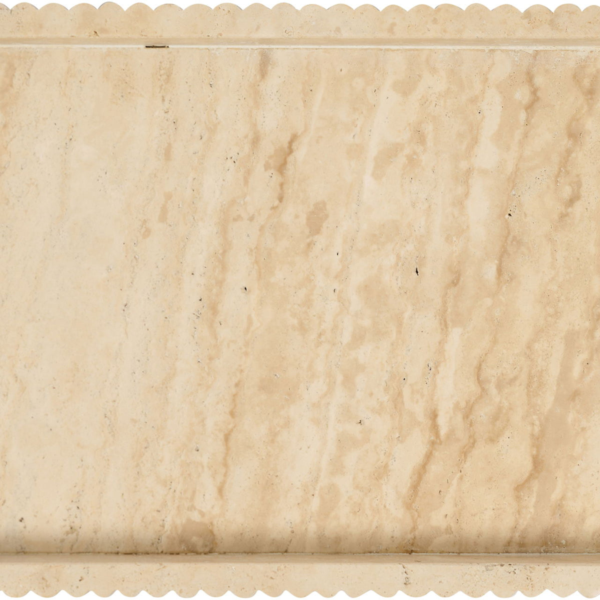 Beige travertine serving tray with scalloped rim and veined stone surface