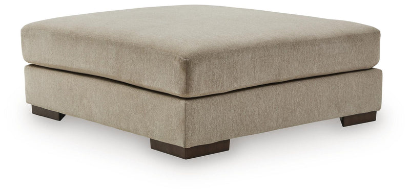 Linenhause oversized accent ottoman in dune beige fabric with dark tapered wood legs