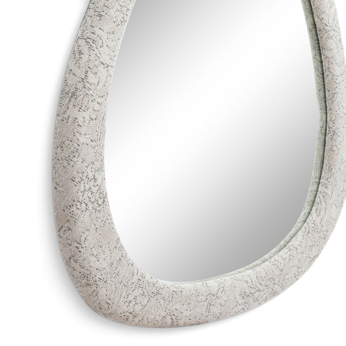 Close-up of triangular mirror frame in pearl silver with textured surface pattern