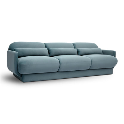 Blue velvet sofa with rounded arms and three seat cushions