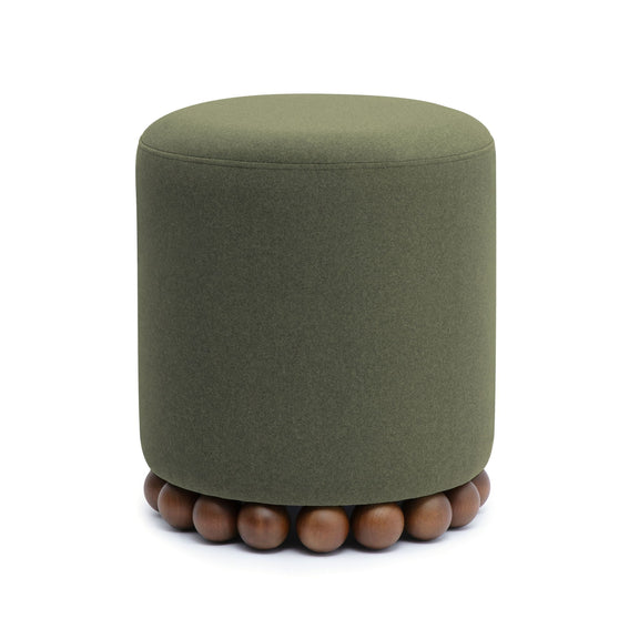 Dark green cylindrical ottoman with fabric upholstery and wooden ball feet