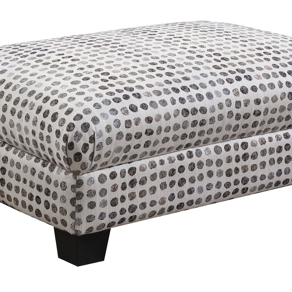 Fabric ottoman with tufted top, white base and dark ink-dot pattern, square legs