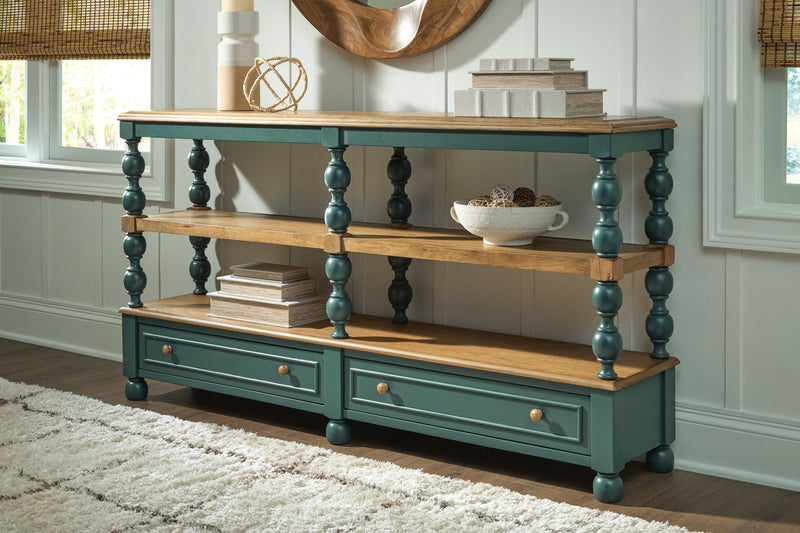 Console table with two shelves and two drawers, light wood surfaces, dark teal finish