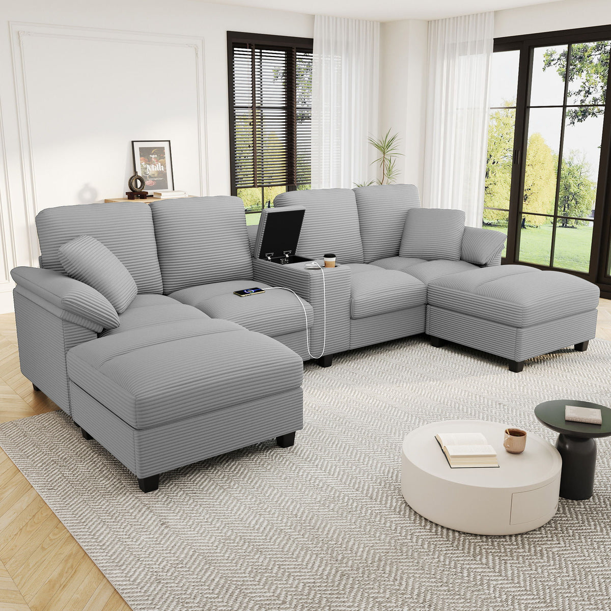 Gray U-shaped sectional sofa with storage ottomans shown from front corner in room