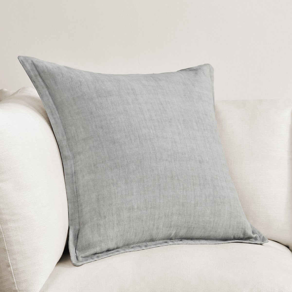 Gray square throw pillow with stitched edges