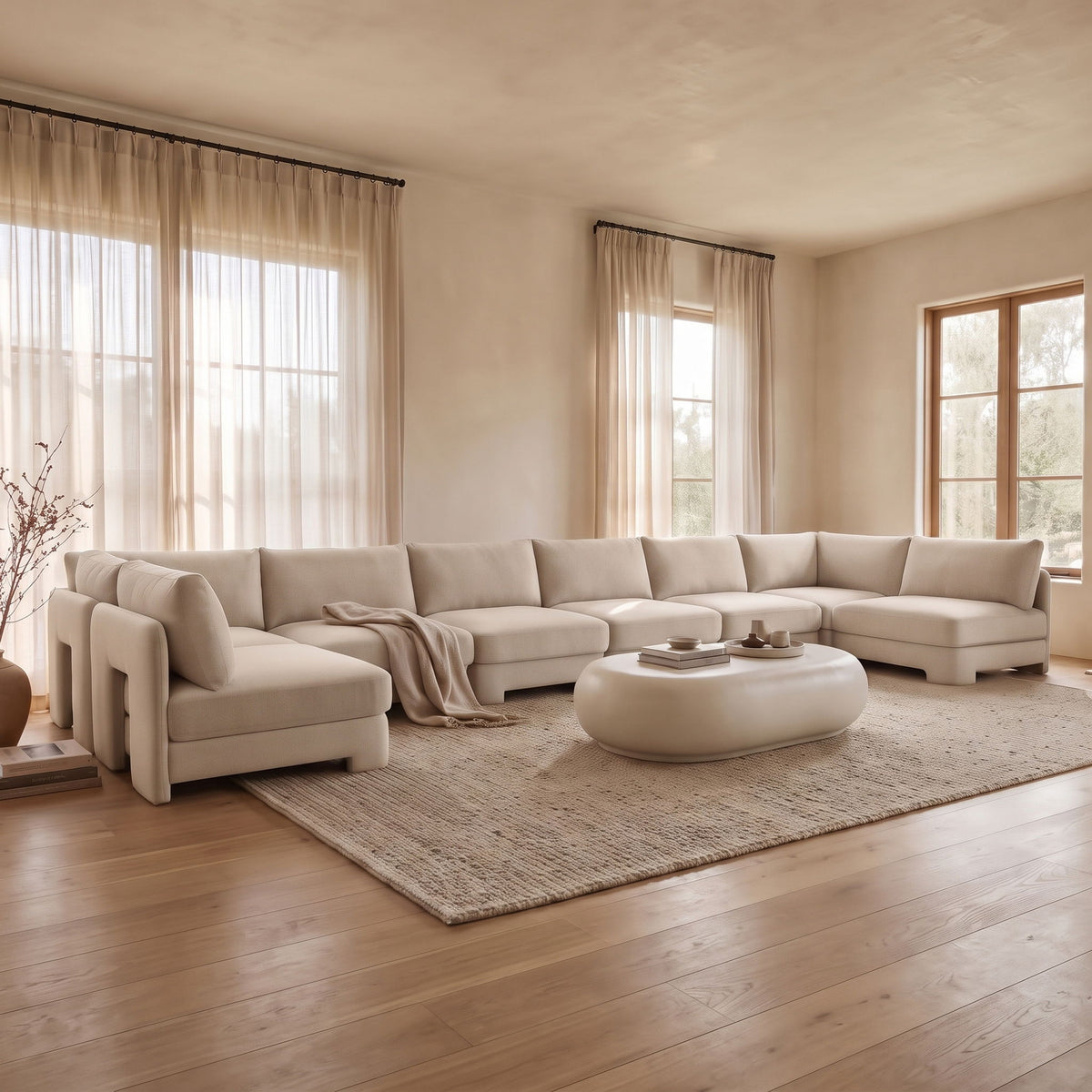 Light beige velvet U-shaped armless sectional sofa with chaise and tufted seat cushions
