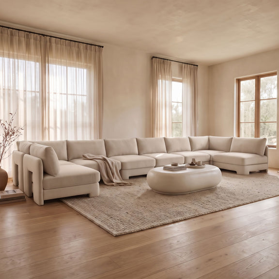 Light beige velvet U-shaped armless sectional sofa with chaise and tufted seat cushions