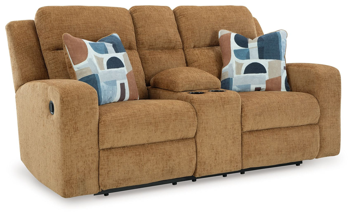 Honey brown double reclining loveseat with console and two patterned accent pillows