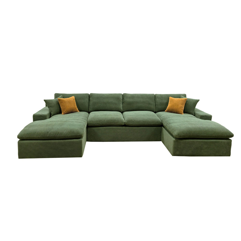 Dark green U-shaped sectional sofa with wide chaise sections and two mustard throw pillows