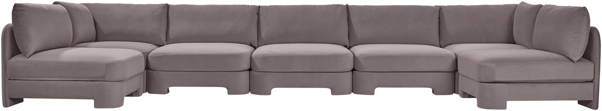 Light gray velvet performance fabric U-shaped armless sectional with multiple connected modules.