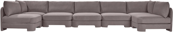 Light gray velvet performance fabric U-shaped armless sectional with multiple connected modules.