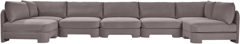Light gray velvet performance fabric U-shaped armless sectional with multiple connected modules.