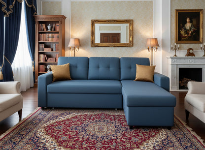 Blue L-shaped sectional sleeper sofa with chaise and two beige throw pillows