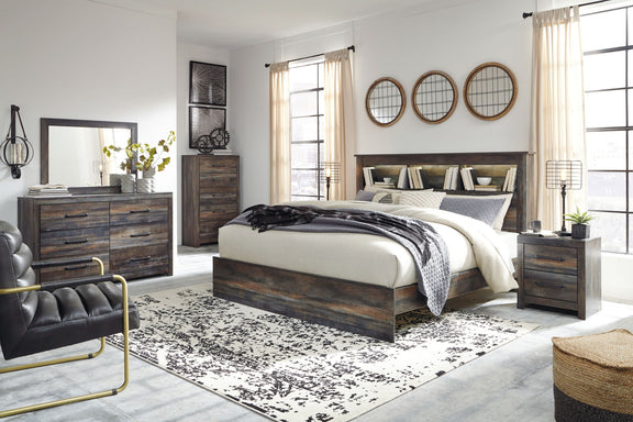 Panel bookcase bed in dark wood with two drawers and bookcase headboard, layered bedding