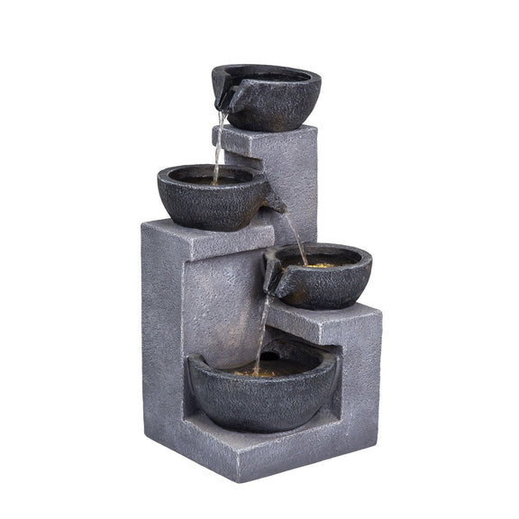 Gray four-tier cascading fountain with textured bowls and flowing water.