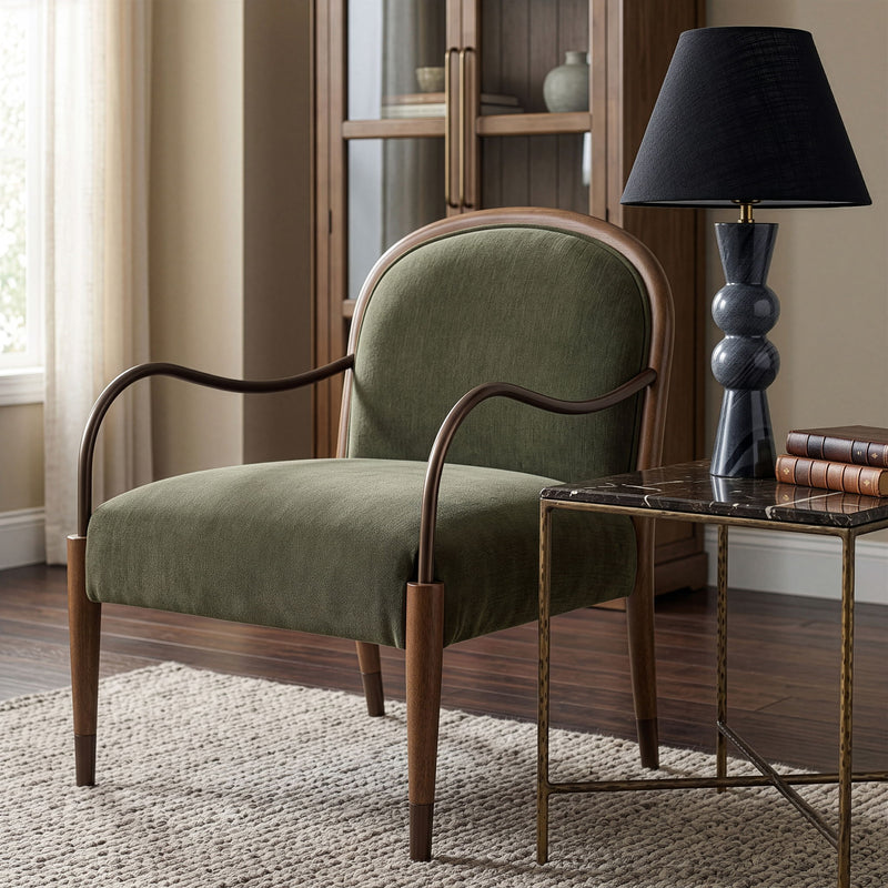 Green fabric upholstered accent chair with curved metal arms and padded seat