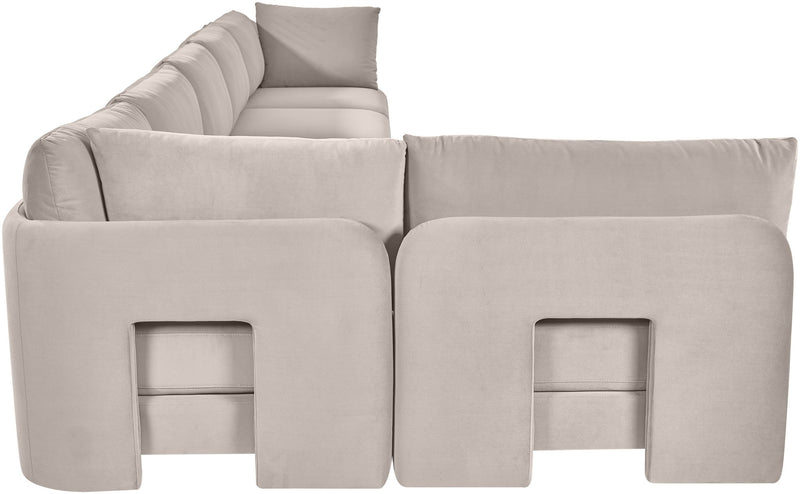 Light gray armless sectional sofa with square front panel detailing and back pillows