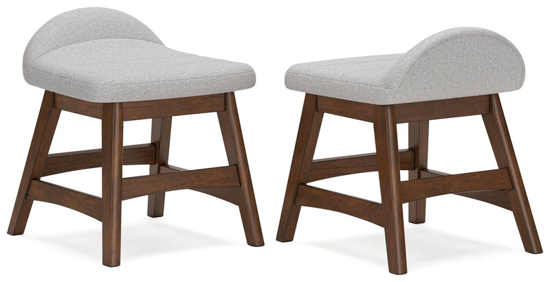 Two light gray upholstered desk chairs with curved seats, brown wooden legs and open sides